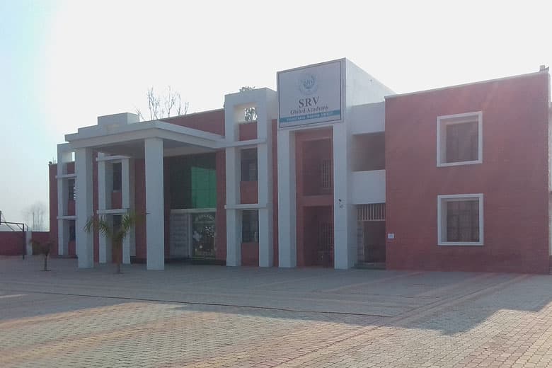 Front view of the school building at Village Bana